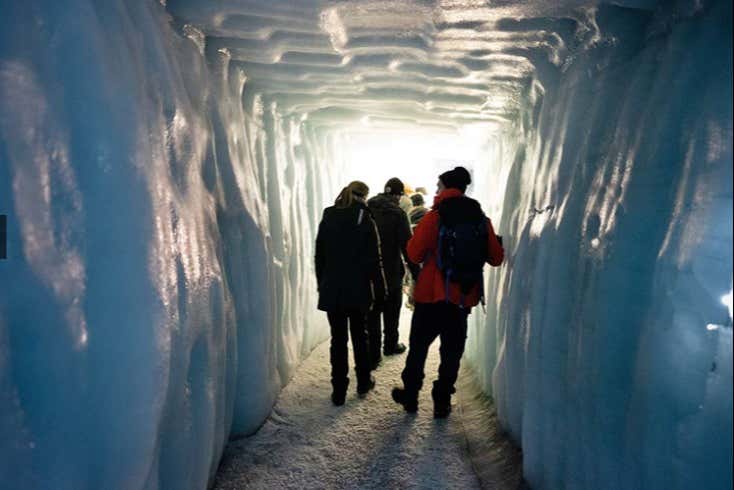 Walking down an ice hallway in the glacier
